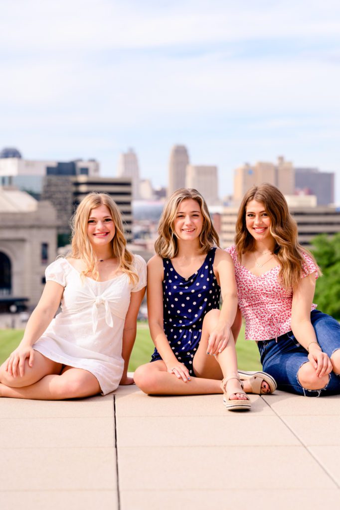 3 high school senior girls dressed in red, white and blue for 4th of July photoshoot